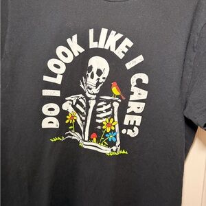 Woman’s Black Graphic Tee with Skeleton and Flowers size: M